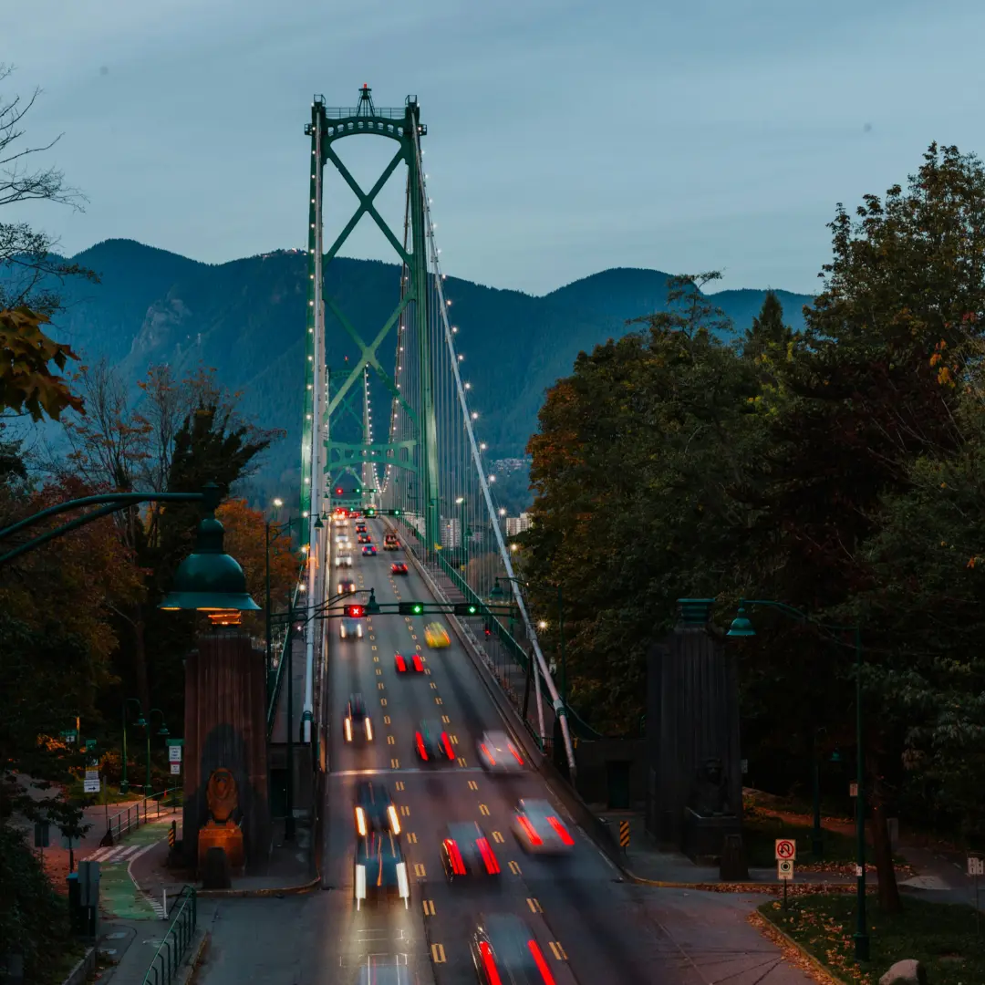 Lions Gate Bridge in Vancouver at dusk with light trails of cars