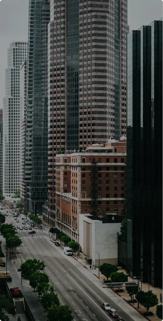 Close-up view of downtown Manhattan skyscrapers, emphasizing architecture and city life