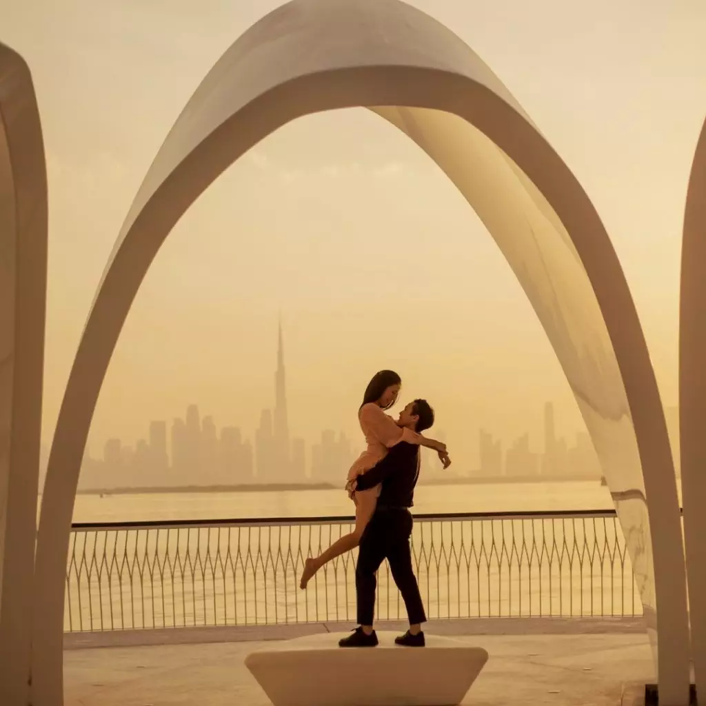 couple posing in Dubai with Burj Khalifa in backgrounf